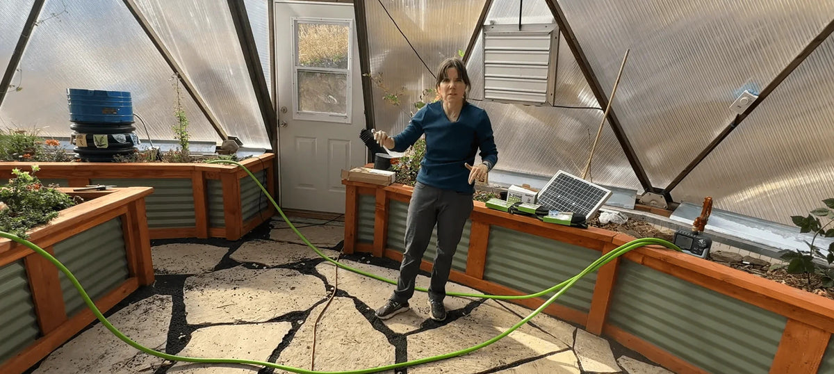 Small greenhouse watering system for vegetable and plant care